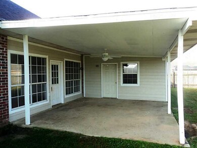 Exterior Front. Patio in Back Yard