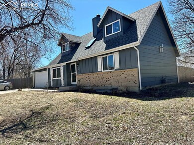 View of front of property with a garage