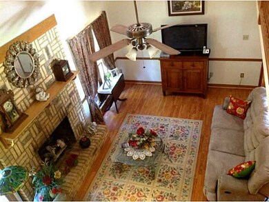 Bright Family Room W/ brick Fireplace, laminate fl