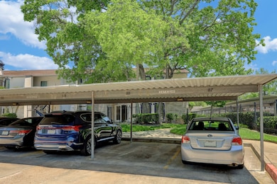 Covered parking area with designated spaces in a r