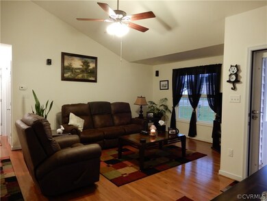 Living Room with surround sound speakers, hardwood
