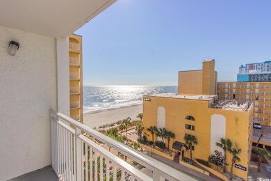 Balcony with a water view and a beach view