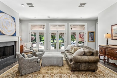 2 living rooms both overlooking beautiful backyard
