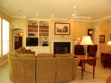 Living Room. Built-in bookcases and arched doorway
