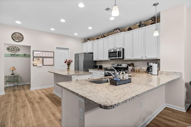 Kitchen with appliances with stainless steel finis