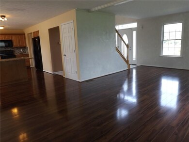 Living/family room opens to the kitchen.  Easy acc