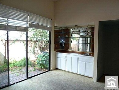 Living room with built in wet bar.