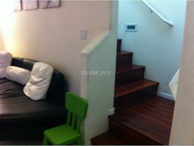 Property Photo. Laminated Wood stairs and Hallway