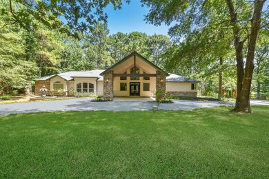 It is impossible to get the entire front of this house in one picture. A majority of this home is handicap accessible offering 5' door openings and wide open spaces.  This home sits on just under 3.5 private acres tucked back in the highly sought after gated neighborhood of Indigo Ranch. Long private driveway leads to the attached garage on the other side of the home.  Drive through Port-o-cochere adorns the double solid mahogany lead glass front doors.