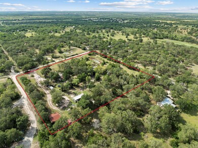 Aerial view of property's location with a forest 