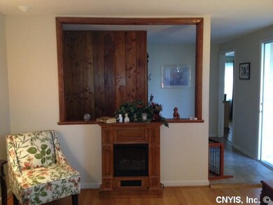 Living Room. Seller has removed part of the wall t