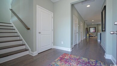 Entryway featuring wood finished floors, baseboards, stairway, and recessed lighting