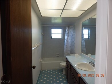 Bathroom featuring vanity and shower / bath combo