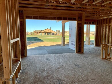Open park space and trails beyond the patios.
