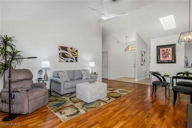 Living area with a skylight, wood finished floors,