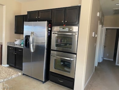 Kitchen featuring stainless steel appliances, ligh