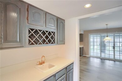 The butler's station features a wet bar, ample storage and a built in wine rack.  This space leads to the chef's kitchen.