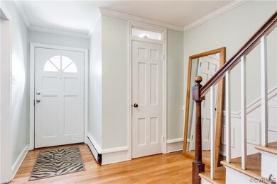 The foyer has access to the powder room, and staircase to the second level.