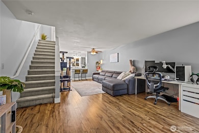 From the open main level, you’ll also find the entrance to the second floor, with stairs leading up to the private bedroom spaces.