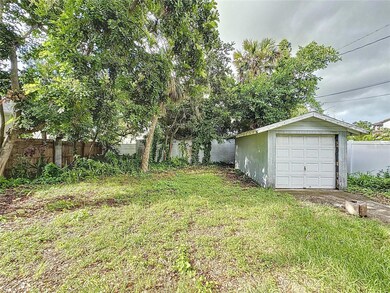Back yard and 1 car detached garage