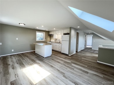 SPACIOUS EAT-IN KITCHEN WITH SKYLIGHT