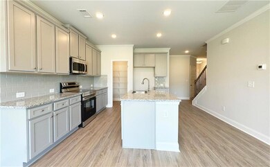 Kitchen featuring a sink, appliances with stainles
