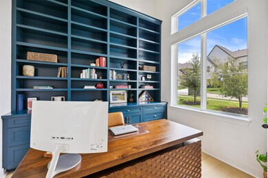 Office space with light wood-type flooring and bu