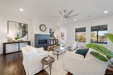 Family Room with hardwoods, wall of windows framin