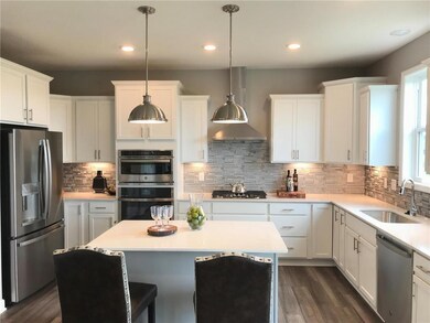 Gourmet kitchen with two cabinet colors is very up