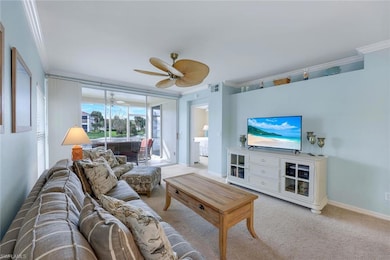 Living room featuring ornamental molding, light co