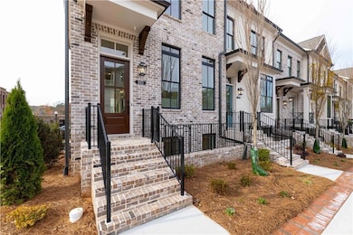 Property entrance featuring brick siding