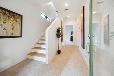 Inviting first-floor entry with elegant tile floor