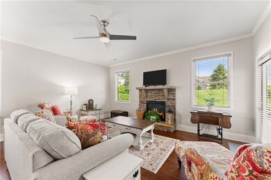 Living area featuring ornamental molding, ceiling 