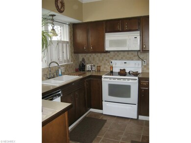 Kitchen is lovely with tile back splash!