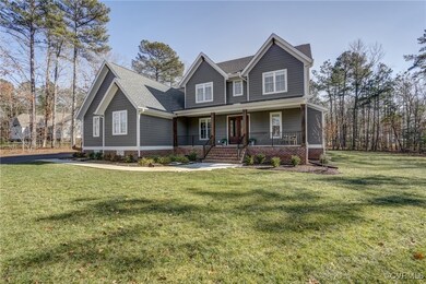 Front view of house from side yard with gorgeous v