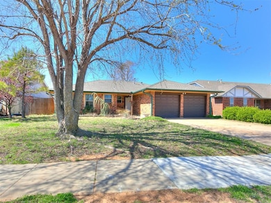 Ranch-style house with fence, concrete driveway, a