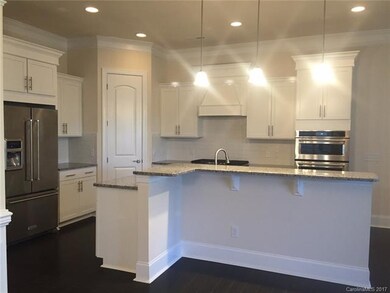 Gorgeous white Gourmet Kitchen with fridge, granit