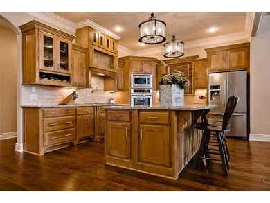 Kitchen. Island prep sink, custom cabinets, pot filler, 2 pullout recycle bins & 1 pull out garbage bin