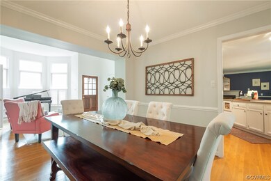Inviting Dining Rm w/chandelier, chair rail & crown molding, hdwd floors, freshly painted. Lots of fond memories will be made here.