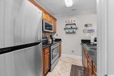 Kitchen with appliances with stainless steel finis