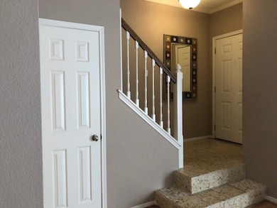 Wonderful entry foyer that features high ceilings and under the stair storage for those suit cases & out of season items like holiday decorations that you want to keep for special occasions but need to tuck away.