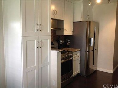 Gorgeous white cabinets, granite counter tops, dar