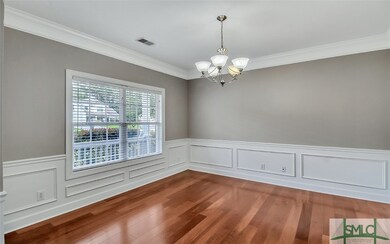 Formal Dining Room Boasts Beautiful Hardwood Floor