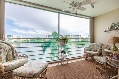 Tiled, screened balcony over looking the lake.
