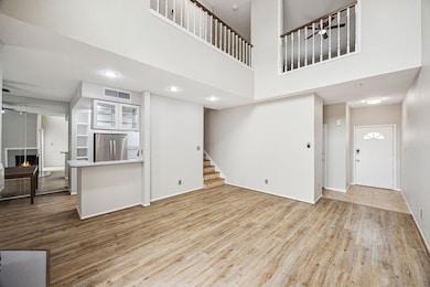 Living room opens to the kitchen and dining area.