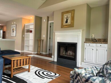 Living room with dark hardwood / wood-style floori