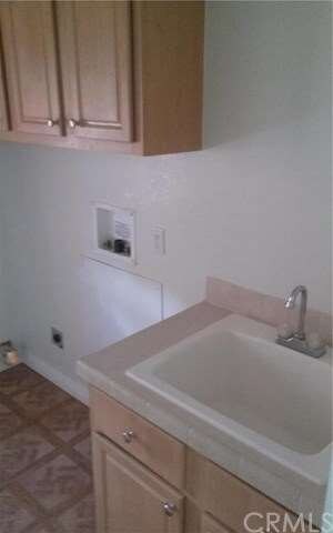 indoor laundry room with sink