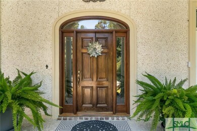 Mahogany front door with transom and sidelights