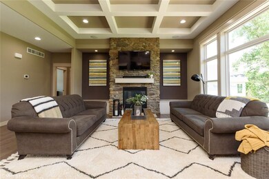 Living Area with Coffered Ceiling, Stone Fireplace