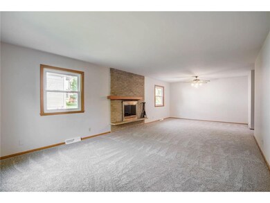 Living room and informal dining with brand new car